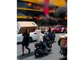 Policía apresa 17 personas por saqueo durante incendio L&R Comercial, en SDE
